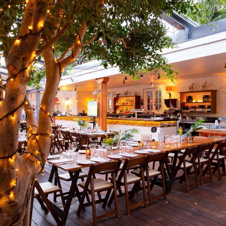 Fairy lights and table set up the garden bar mona vale hotel 